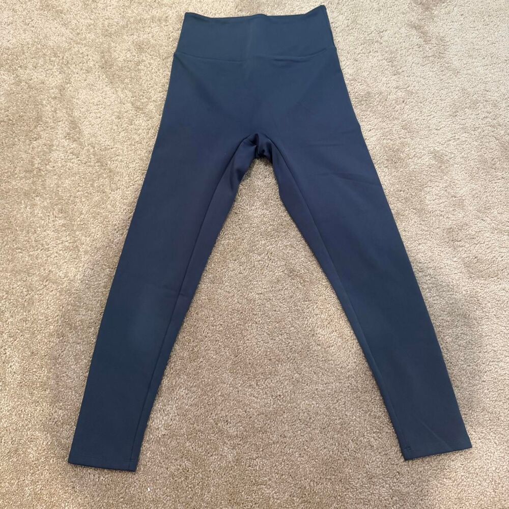 Girlfriend collective leggings in dark teal blue